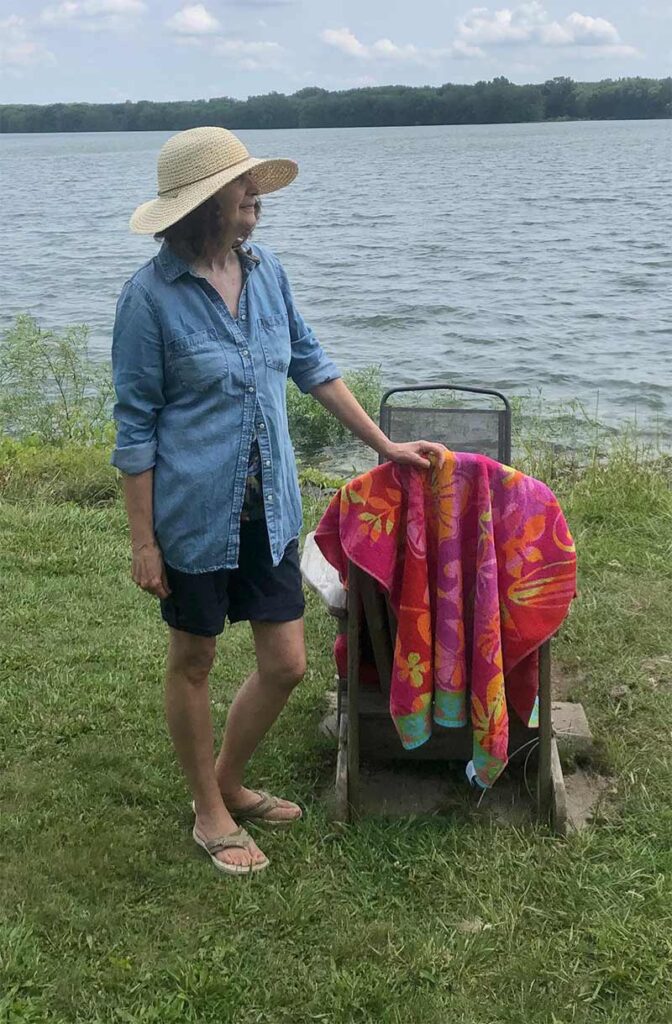 Judy Hansen standing at shoreline